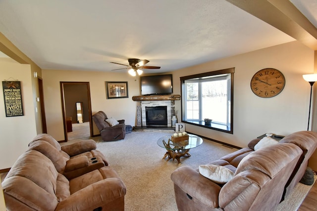 40749 Greencrest Rd, Crow River Twp, MN 56312 - carpeted living room featuring baseboards, a fireplace, and ceiling fan