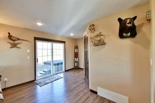 40749 Greencrest Rd, Crow River Twp, MN 56312 - doorway to outside with baseboards, wood finished floors, visible vents, and recessed lighting
