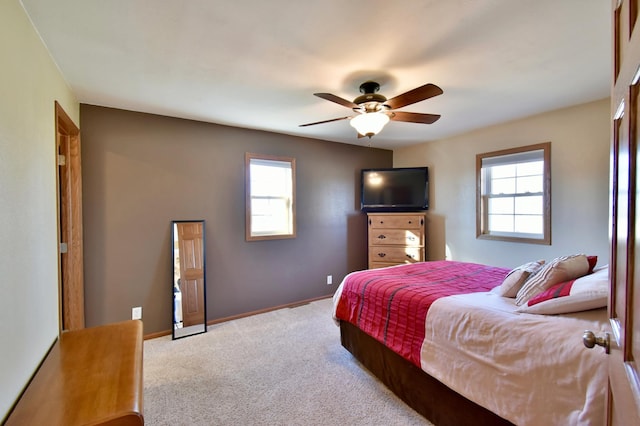 40749 Greencrest Rd, Crow River Twp, MN 56312 - bedroom with ceiling fan, baseboards, carpet flooring, and multiple windows