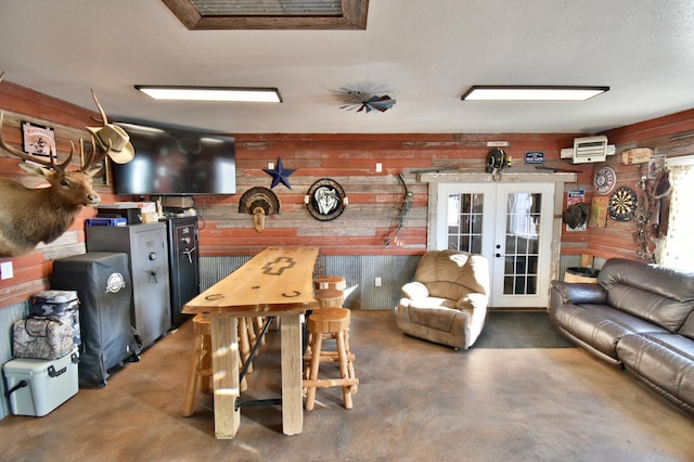 40749 Greencrest Rd, Crow River Twp, MN 56312 - interior space featuring finished concrete floors, wood walls, and french doors