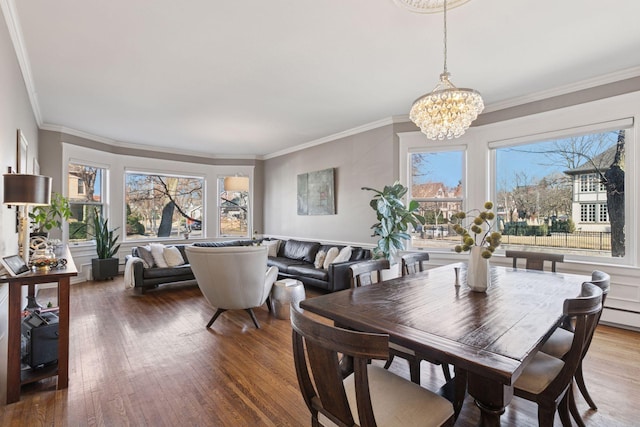 1801 Fremont Ave S Unit 101, Minneapolis, MN 55403 - dining space featuring a chandelier, healthy amount of natural light, ornamental molding, and wood finished floors