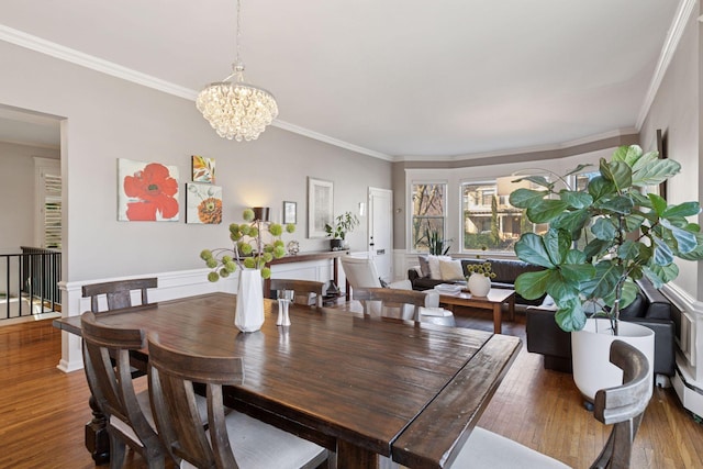 1801 Fremont Ave S Unit 101, Minneapolis, MN 55403 - dining area with a chandelier, wood finished floors, and ornamental molding