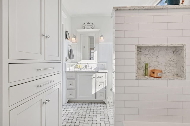 1801 Fremont Ave S Unit 101, Minneapolis, MN 55403 - bathroom with crown molding, vanity, wainscoting, and tile patterned flooring