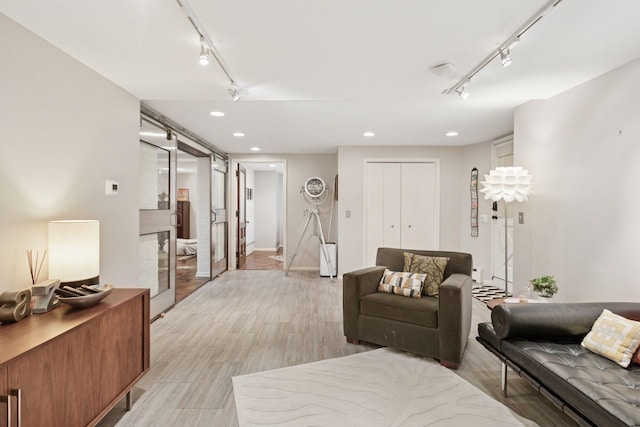 1801 Fremont Ave S Unit 101, Minneapolis, MN 55403 - living area featuring rail lighting, recessed lighting, and light wood finished floors