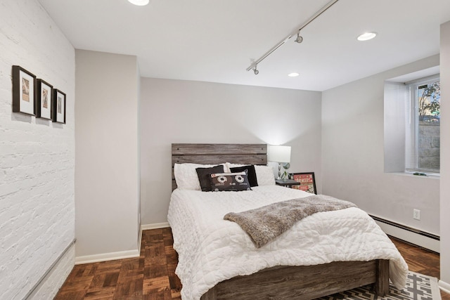 1801 Fremont Ave S Unit 101, Minneapolis, MN 55403 - bedroom with a baseboard heating unit, rail lighting, baseboards, and recessed lighting
