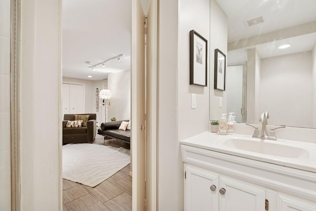 1801 Fremont Ave S Unit 101, Minneapolis, MN 55403 - bathroom with connected bathroom, track lighting, and vanity