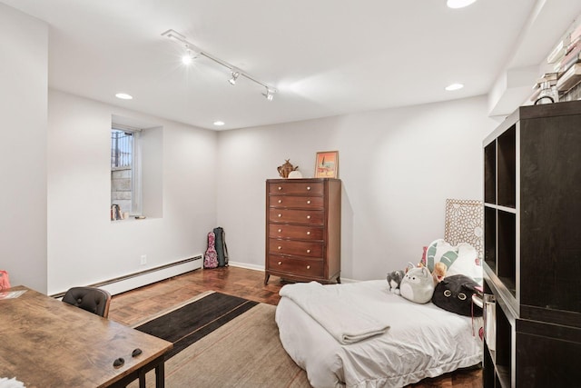 1801 Fremont Ave S Unit 101, Minneapolis, MN 55403 - bedroom with a baseboard radiator, rail lighting, recessed lighting, wood finished floors, and baseboards