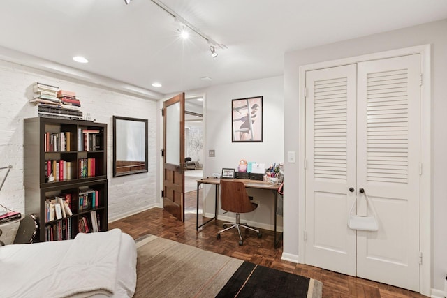1801 Fremont Ave S Unit 101, Minneapolis, MN 55403 - bedroom with a desk, baseboards, rail lighting, a closet, and recessed lighting