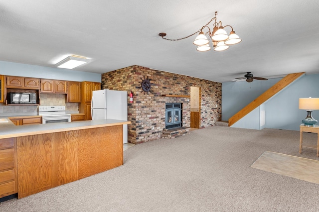 kitchen featuring open floor plan, light countertops, white appliances, brown cabinets, and light carpet