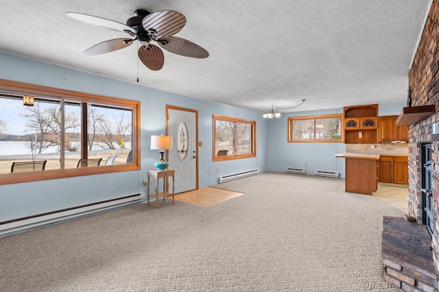 unfurnished living room with a textured ceiling, a baseboard heating unit, and light carpet