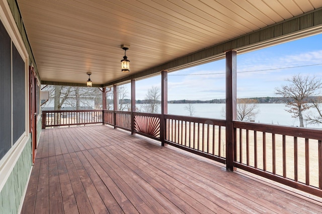 wooden deck with a water view