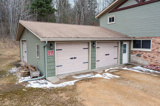 view of snow covered garage