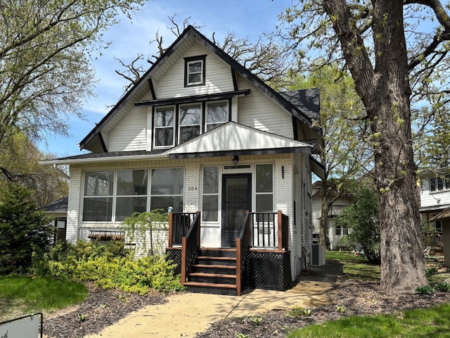304 7th Pl NW, Austin, MN 55912 - view of front of home with brick siding and a shingled roof