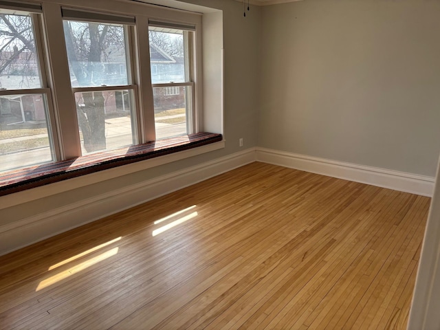 304 7th Pl NW, Austin, MN 55912 - empty room featuring baseboards and light wood finished floors