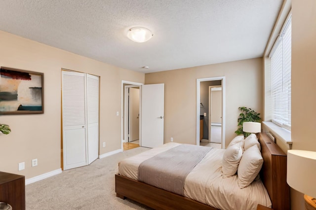 3150 Excelsior Blvd Unit 304, Minneapolis, MN 55416 - bedroom with light colored carpet, baseboards, a textured ceiling, and a closet