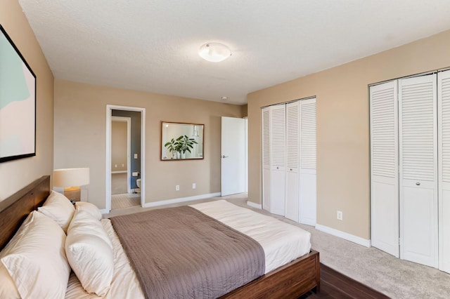 3150 Excelsior Blvd Unit 304, Minneapolis, MN 55416 - bedroom featuring baseboards, multiple closets, and carpet floors