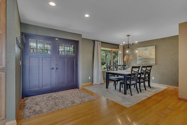 3202 Riviera Rd, Sartell, MN 56377 - dining room featuring baseboards, recessed lighting, wood finished floors, and a notable chandelier