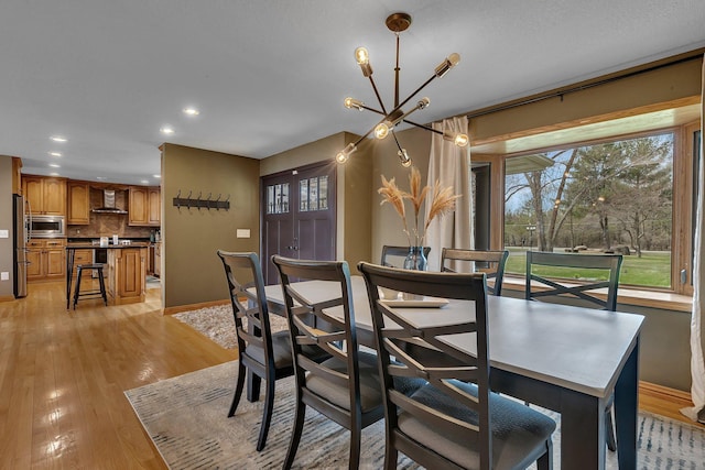 3202 Riviera Rd, Sartell, MN 56377 - dining space with an inviting chandelier, recessed lighting, baseboards, and plenty of natural light
