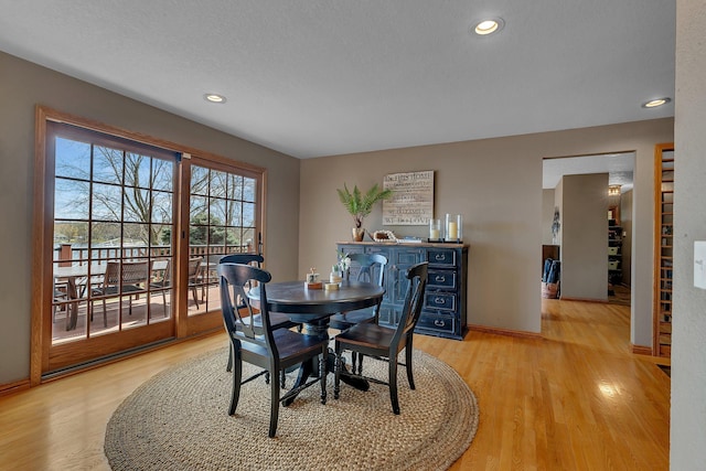 3202 Riviera Rd, Sartell, MN 56377 - dining room featuring recessed lighting, a textured ceiling, light wood-style flooring, and baseboards