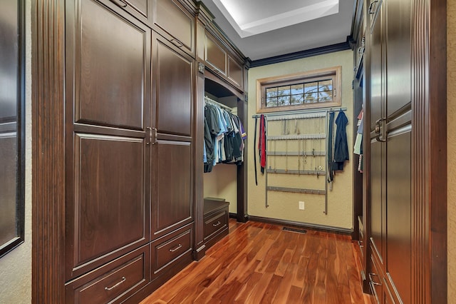 3202 Riviera Rd, Sartell, MN 56377 - spacious closet featuring dark wood finished floors and visible vents