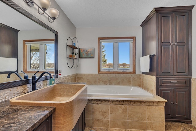 3202 Riviera Rd, Sartell, MN 56377 - full bathroom with a textured ceiling and a bath