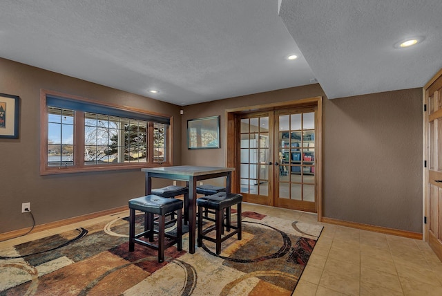 3202 Riviera Rd, Sartell, MN 56377 - dining area featuring baseboards, a textured ceiling, and french doors