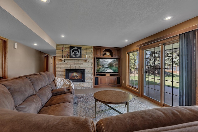 3202 Riviera Rd, Sartell, MN 56377 - living area featuring tile patterned floors, a fireplace, recessed lighting, and a textured ceiling