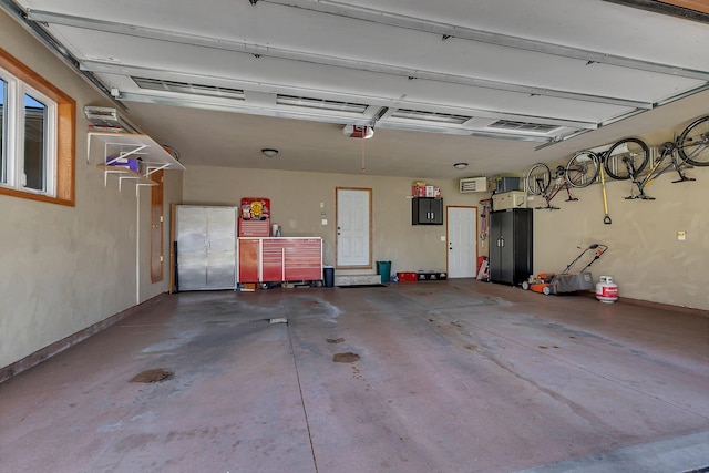 3202 Riviera Rd, Sartell, MN 56377 - garage featuring baseboards, a garage door opener, and electric panel