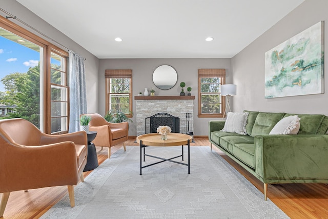 7244 12th Ave S, Richfield, MN 55423 - living area featuring light wood-style flooring, plenty of natural light, a stone fireplace, and recessed lighting