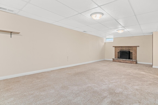 7244 12th Ave S, Richfield, MN 55423 - unfurnished living room featuring a paneled ceiling, a brick fireplace, and carpet flooring