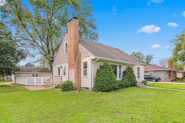 7244 12th Ave S, Richfield, MN 55423 - view of side of home featuring a yard, a chimney, and roof with shingles
