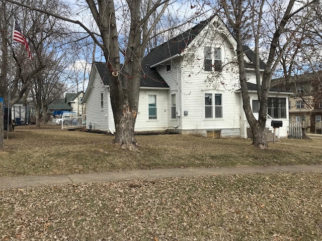 traditional-style house with roof with shingles
