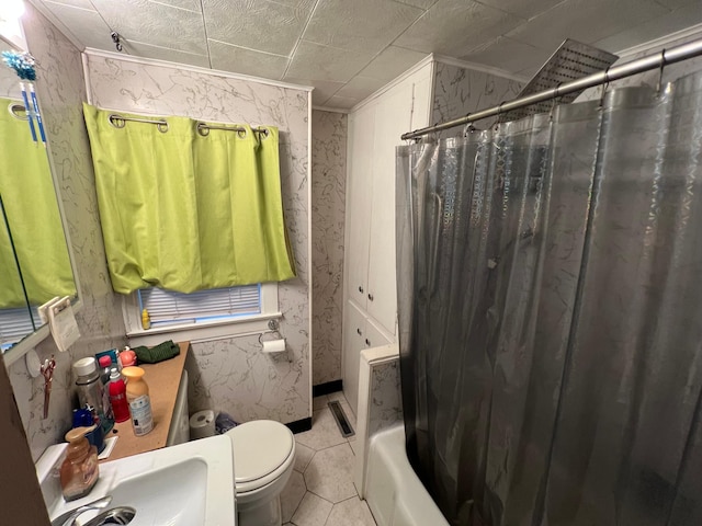 full bath with wallpapered walls, toilet, a sink, shower / bath combo, and tile patterned flooring