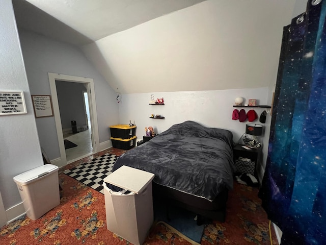bedroom featuring vaulted ceiling