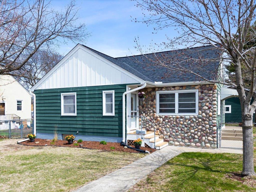240 13th Ave N, South Saint Paul, MN 55075 - view of front facade with a front yard, a shingled roof, a gate, board and batten siding, and fence