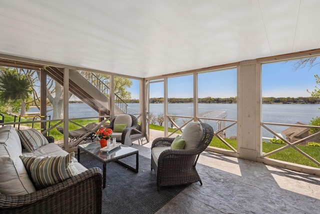 sunroom / solarium with outdoor lounge area and a water view