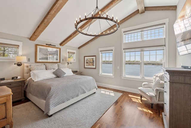 bedroom with wood finished floors, high vaulted ceiling, a chandelier, beamed ceiling, and baseboards