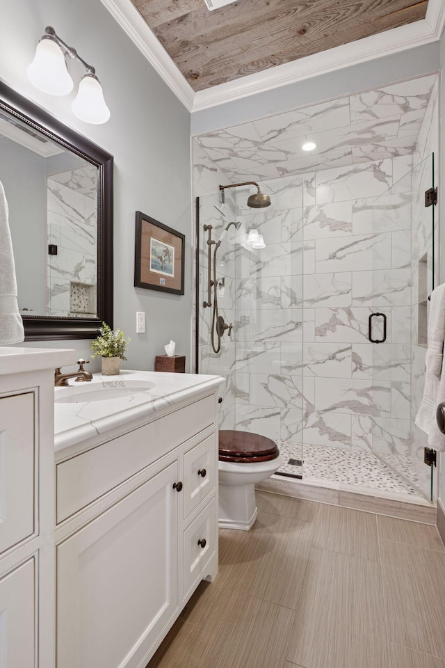 full bathroom with a marble finish shower, ornamental molding, vanity, and toilet