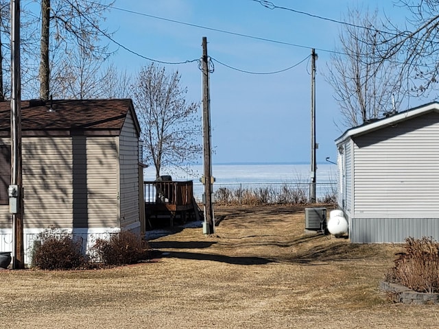 view of yard with central AC unit