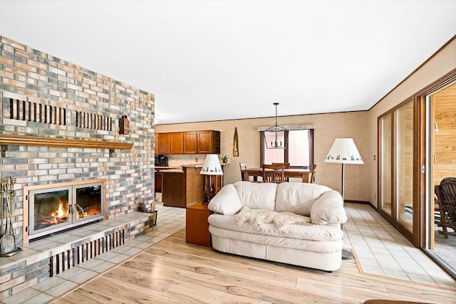 living area featuring a fireplace and light wood-type flooring