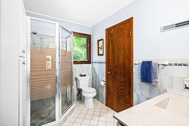 full bathroom with vanity, toilet, tile patterned floors, a stall shower, and visible vents