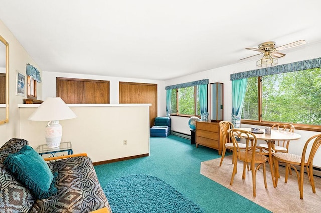 interior space with baseboard heating and carpet