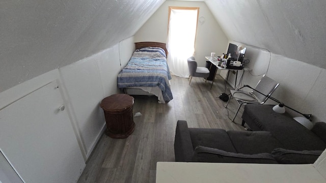 810 11th Ave SW, Austin, MN 55912 - bedroom featuring vaulted ceiling and wood finished floors