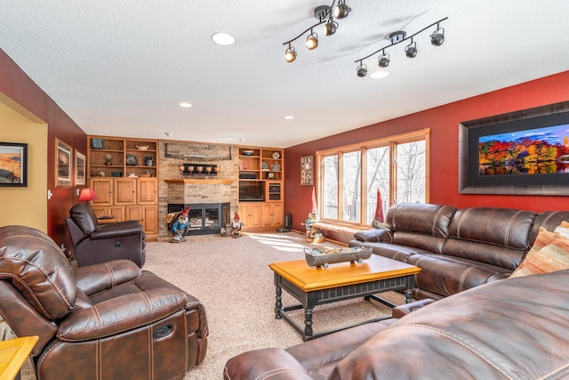 27192 237th Ave SW, Crookston Twp, MN 56716 - carpeted living room featuring a fireplace, built in shelves, a textured ceiling, and baseboards