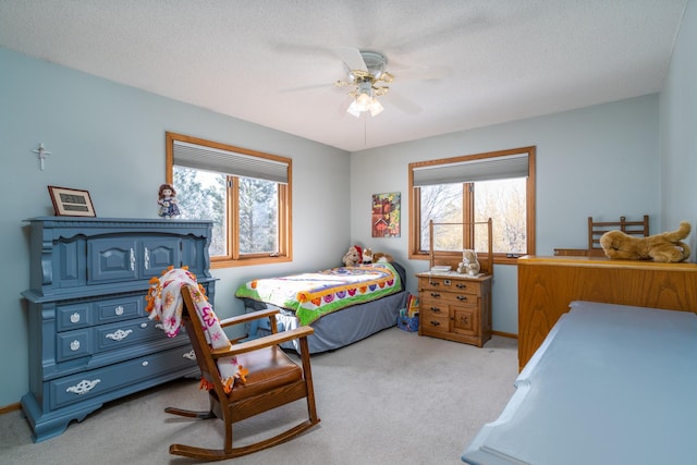 27192 237th Ave SW, Crookston Twp, MN 56716 - bedroom with light colored carpet, ceiling fan, and baseboards