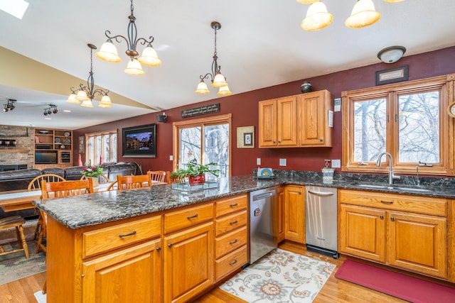 27192 237th Ave SW, Crookston Twp, MN 56716 - kitchen with a sink, dishwasher, a chandelier, vaulted ceiling, and a peninsula