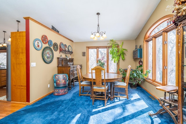 27192 237th Ave SW, Crookston Twp, MN 56716 - dining room with a chandelier and baseboards