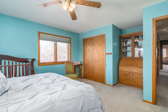 27192 237th Ave SW, Crookston Twp, MN 56716 - bedroom with multiple windows, a closet, carpet floors, and ceiling fan