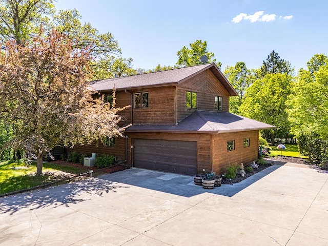 27192 237th Ave SW, Crookston Twp, MN 56716 - view of property exterior featuring driveway, a garage, and roof with shingles