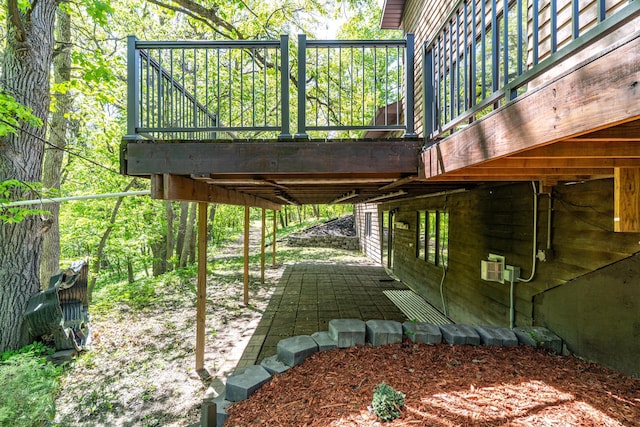 27192 237th Ave SW, Crookston Twp, MN 56716 - view of home's exterior featuring a patio area and a wooden deck